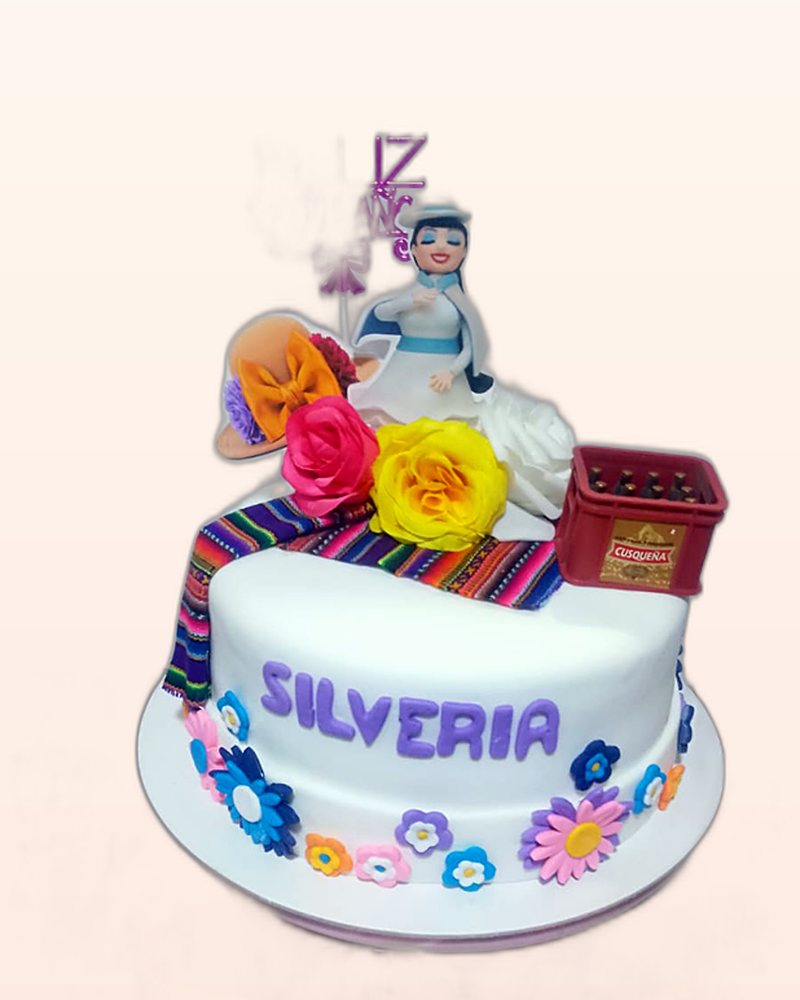 Torta y cupcakes decorados a juego para una mesa de dulces